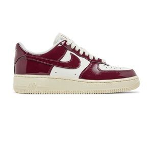 Nike women’s Air Force 1 Low maroon and white sneakers.